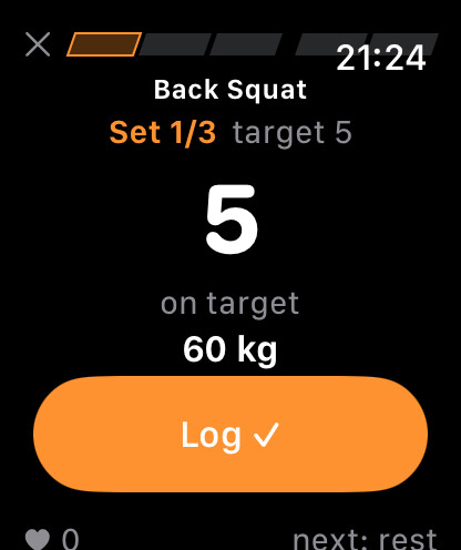 Logging a set on Apple Watch: reps and load controls with the workout's meter bar across the top